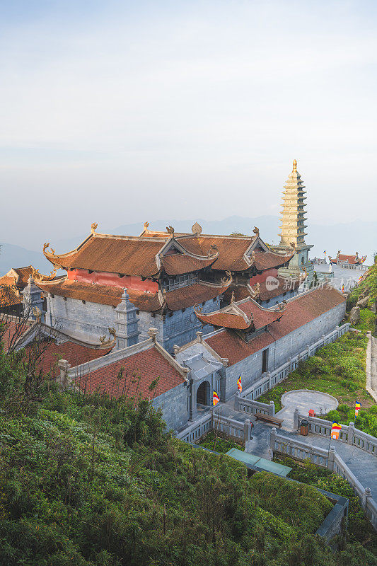 Vertical scenic morning view at Kim Son Bao Thang Tu Pagoda on Fansipan mountain. tourist attraction view Fansipan highest mountain peak of Indochina in SAPA Lao cai northern of Vietnam most popular traveling destination